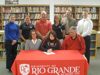 Logan Elm High's Tiffany Bise is surrounded by her parents, coaches and school administrators as she signs with Rio Grande.